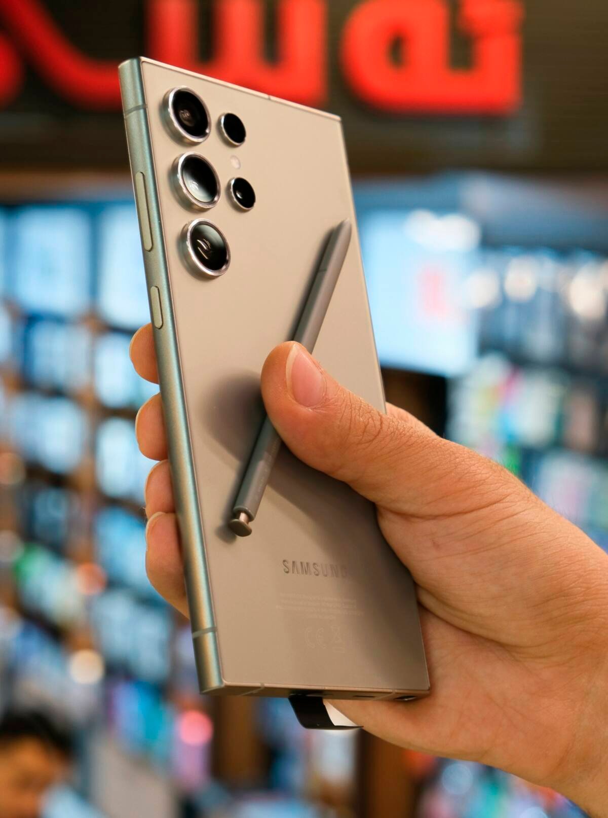 Person holding a silver Samsung Galaxy S26 Ultra smartphone