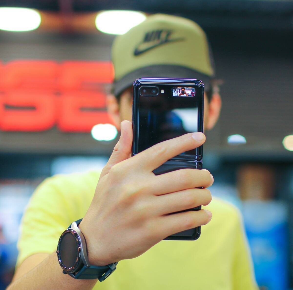 Person holding a black Samsung Galaxy foldable smartphone