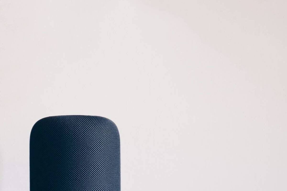 Black Apple HomePod speaker on a table