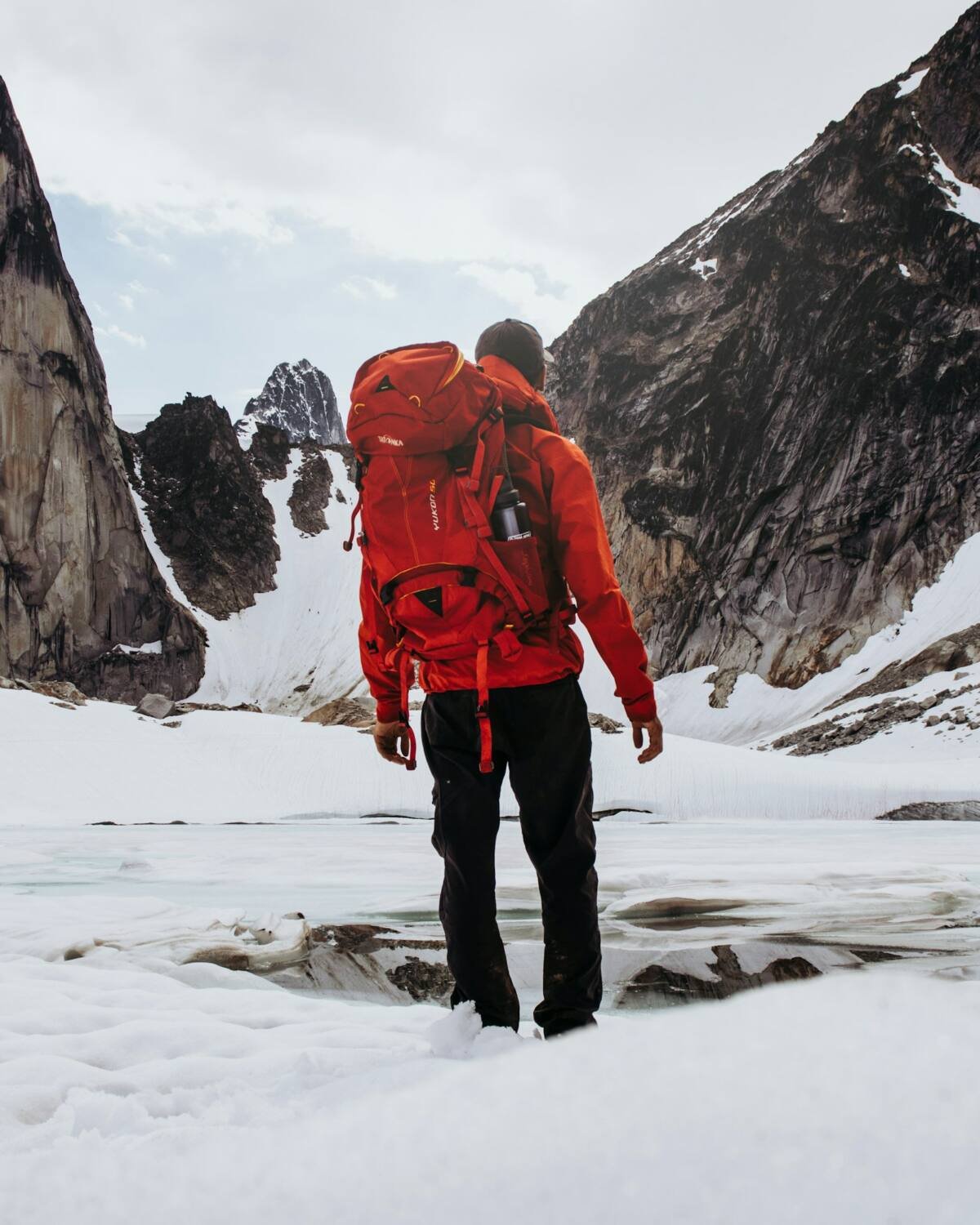 Man carrying a hiking backpack