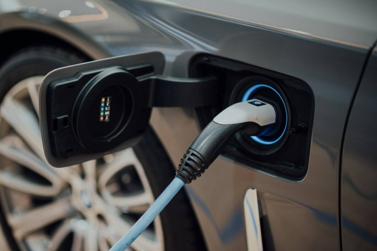 Electric vehicle charging cable plugged into a car
