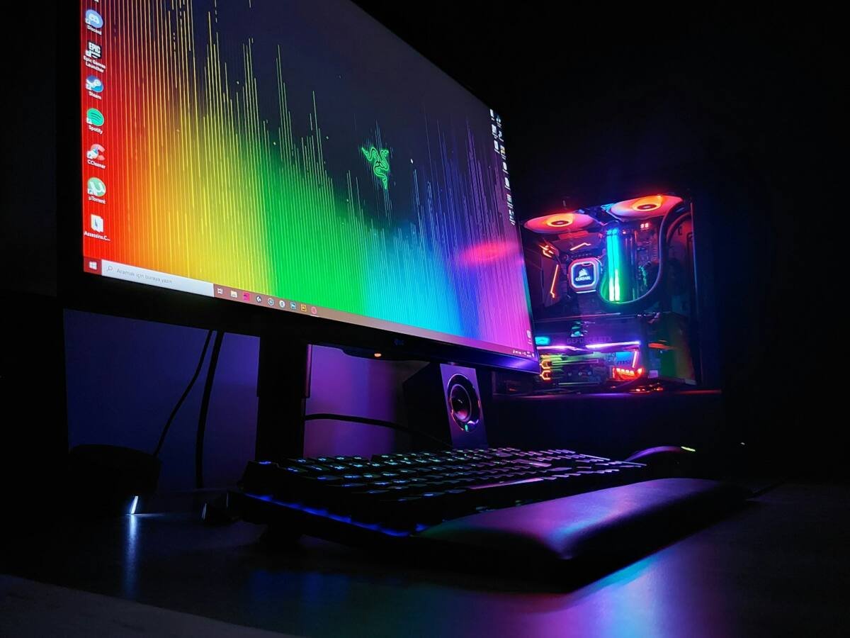 Black flat screen monitor beside a keyboard