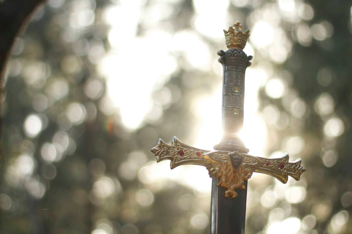 Close-up photography of a gold-colored and black sword