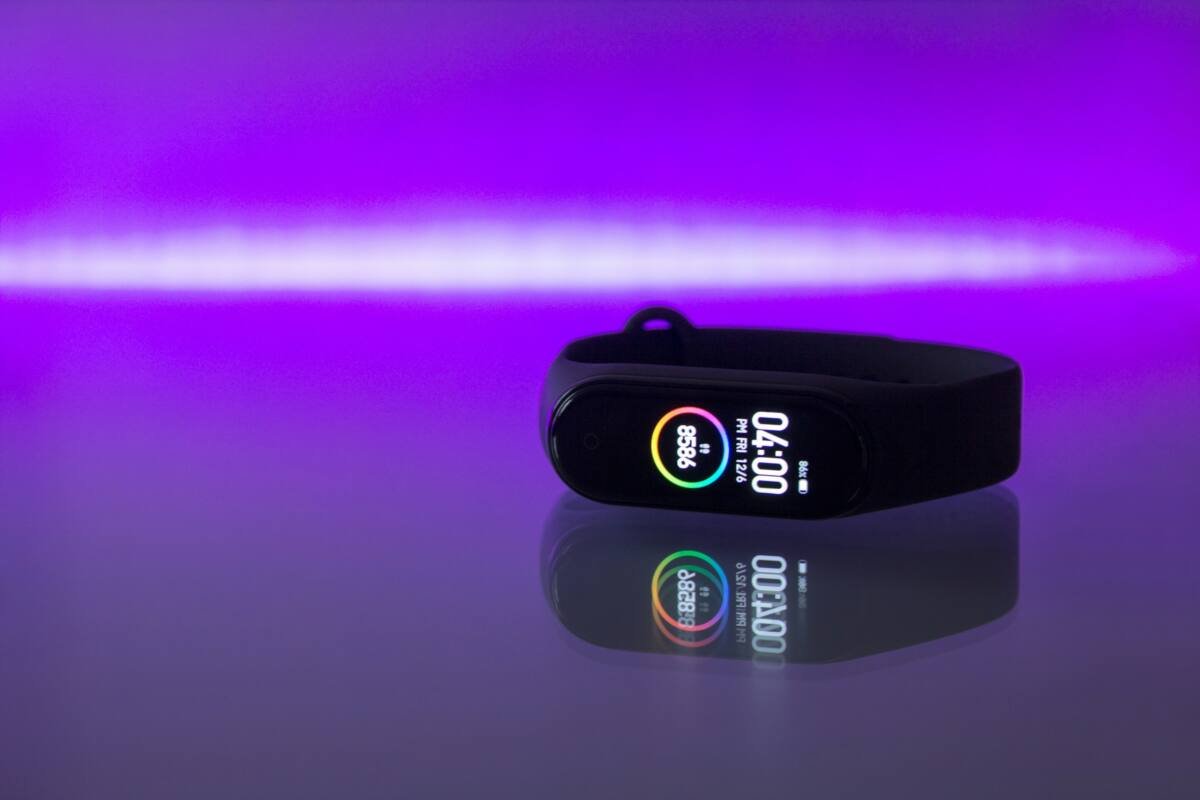 Black fitness tracker with a small display