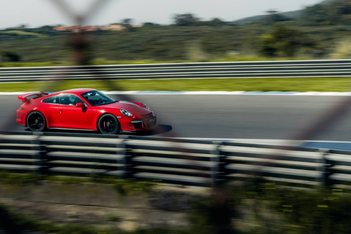 Red sports car racing on a track