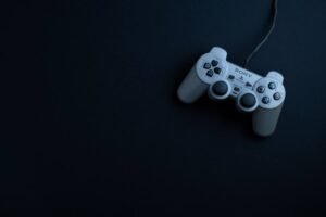 Top-down view of a game controller on a dark surface
