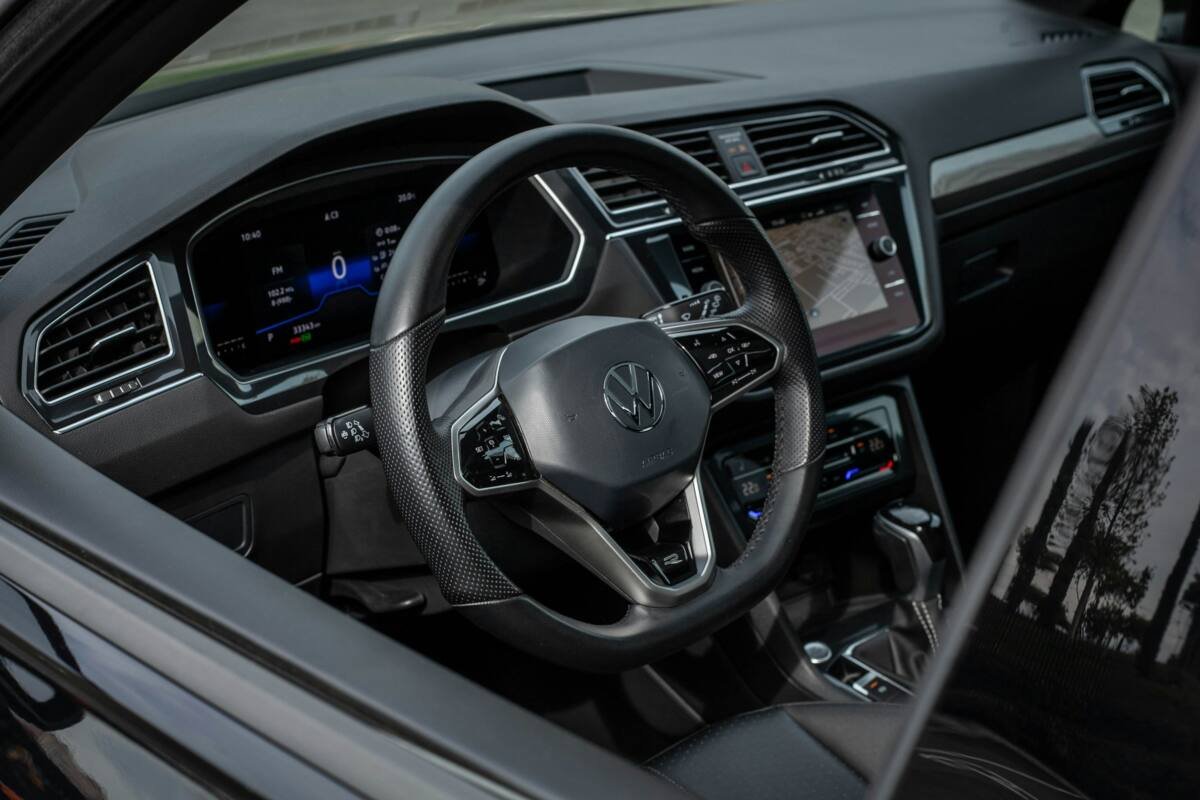 Modern car interior with a digital dashboard and steering wheel